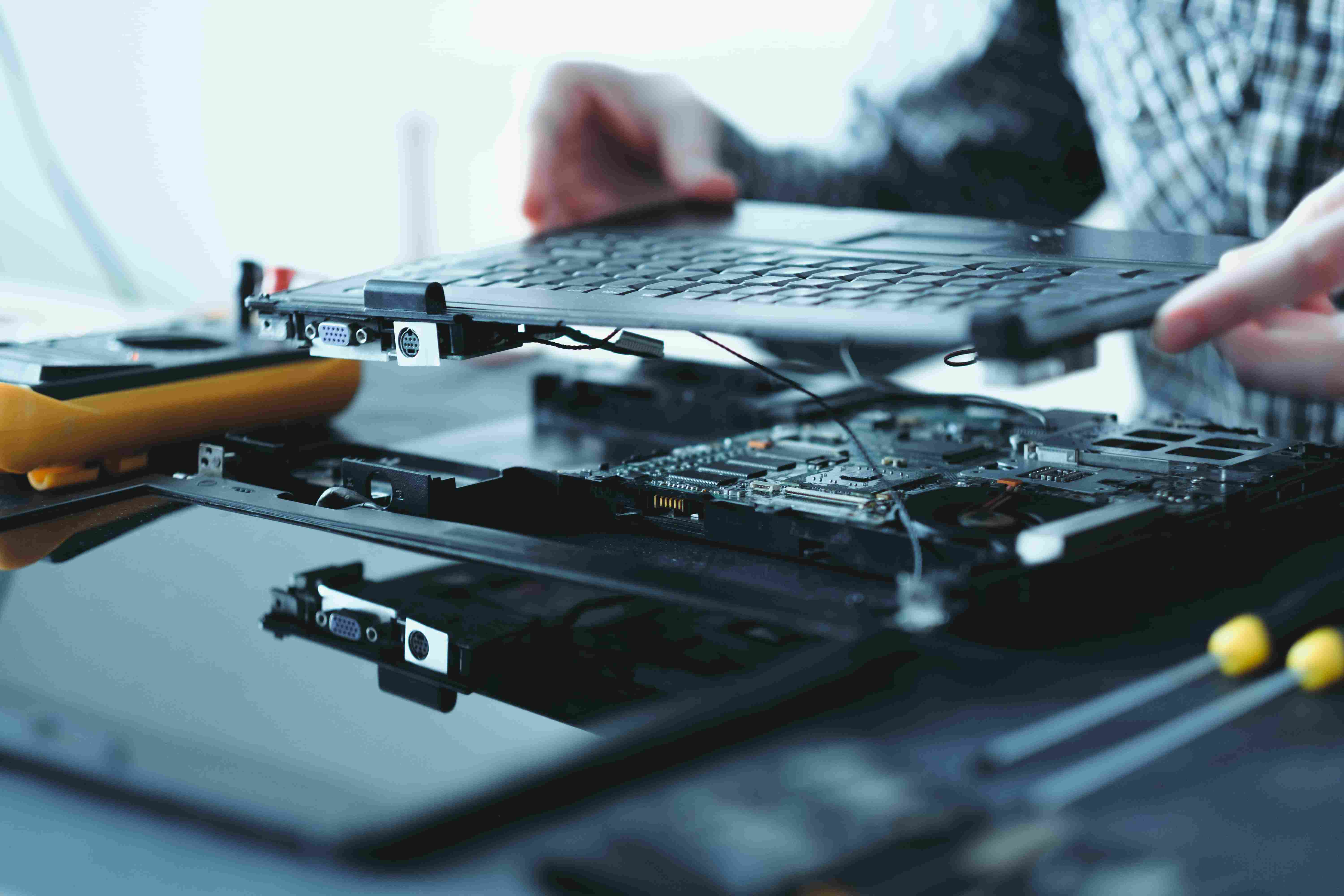 Laptop keyboard assembly being repaired